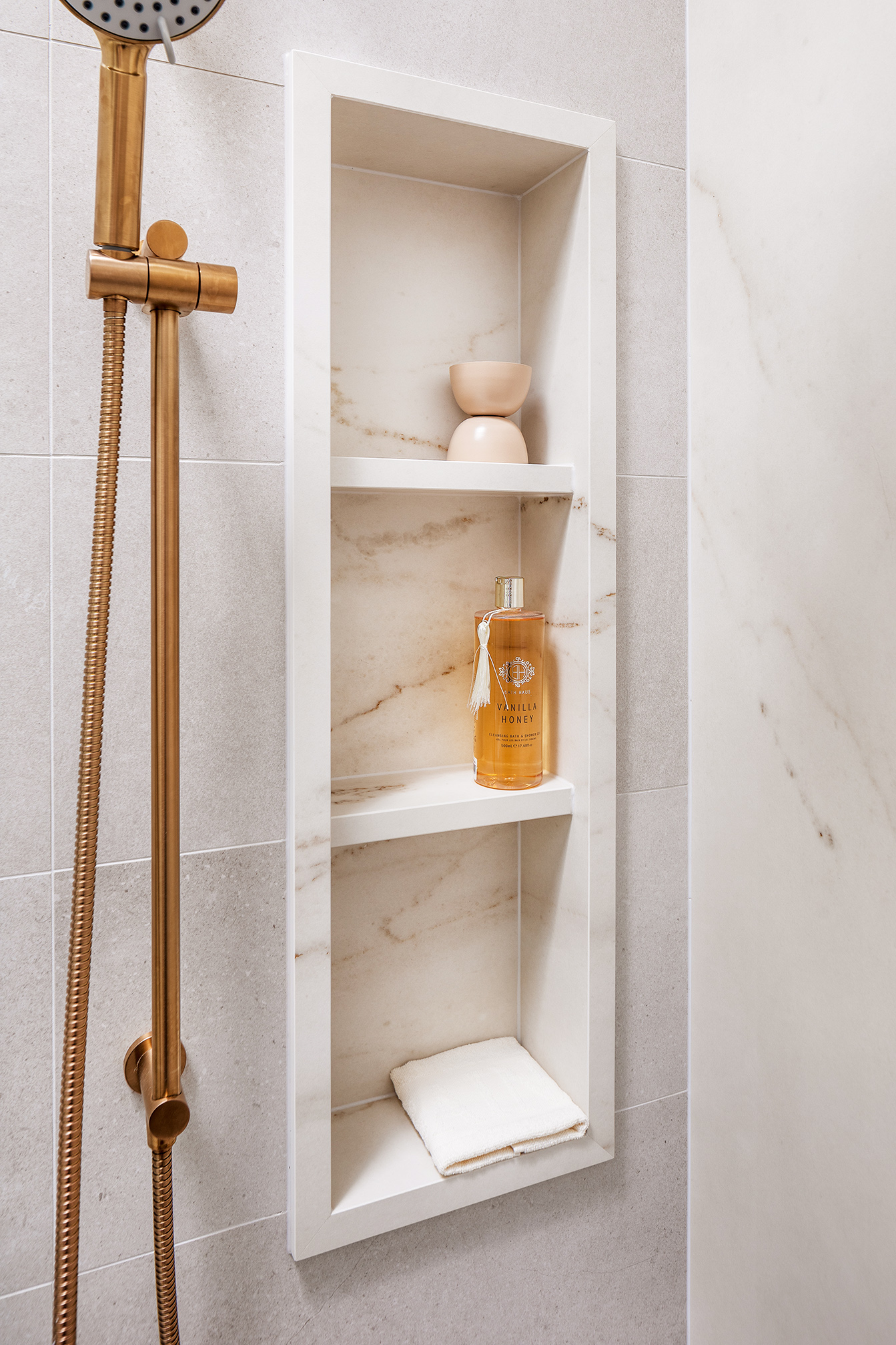 bravvo's rem dekton porcelain tile bathroom shower shelf